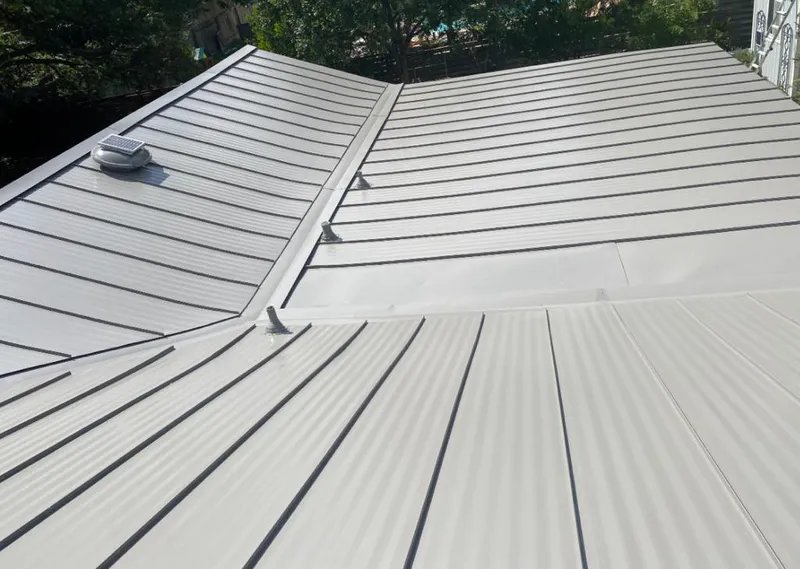 Solar attic fan installed on a metal roof for Roof Ventilation in La Grange